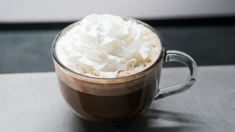 a hot coffee with whipped cream